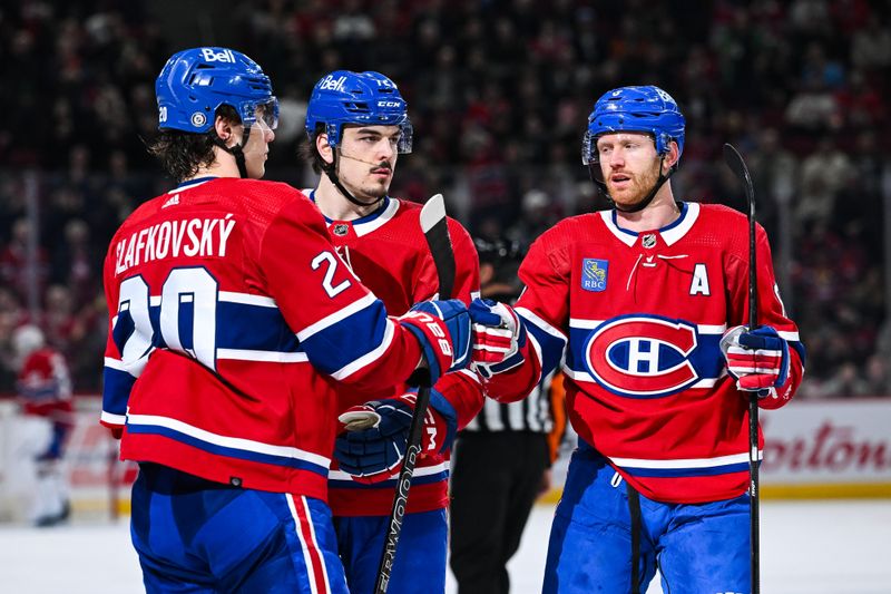 Apr 4, 2024; Montreal, Quebec, CAN; Montreal Canadiens left wing Juraj Slafkovsky (20) celebrates his goal against the Tampa Bay Lightning with =mm8 and defenseman Arber Xhekaj (72) during the third period at Bell Centre. Mandatory Credit: David Kirouac-USA TODAY Sports