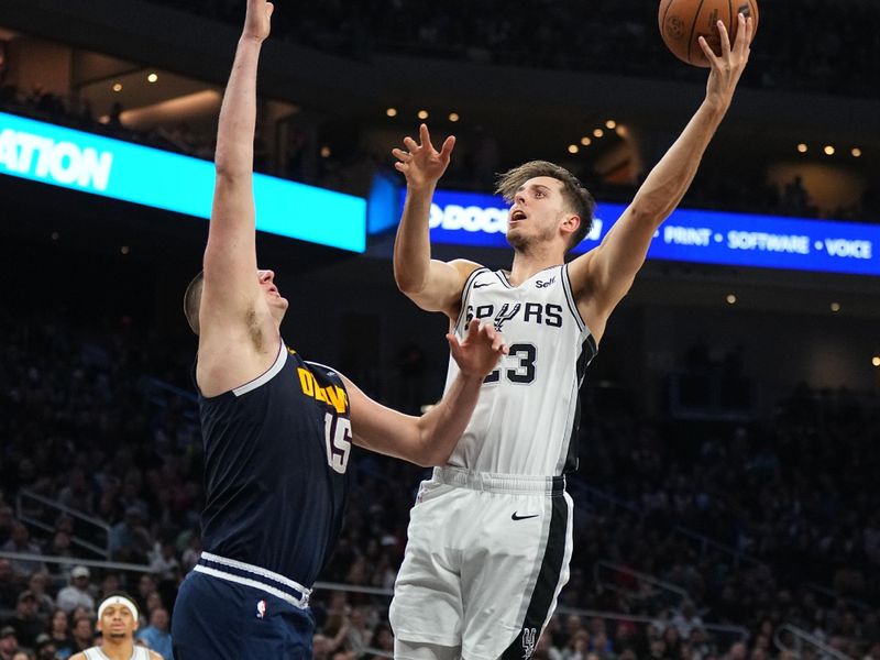 AUSTIN, TX - MARCH 15: Zach Collins #23 of the San Antonio Spurs drives to the basket during the game against the Denver Nuggets on March 15, 2024 at the Moody Center in Austin, Texas. NOTE TO USER: User expressly acknowledges and agrees that, by downloading and/or using this Photograph, user is consenting to the terms and conditions of the Getty Images License Agreement. Mandatory Copyright Notice: Copyright 2024 NBAE (Photo by Garrett Ellwood/NBAE via Getty Images)