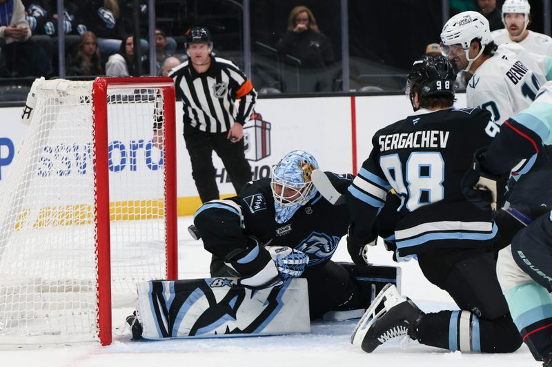 Dec 12, 2025; Salt Lake City, Utah, USA; Utah Mammoth goaltender Karel Vejmelka (70) blocks the puck with his elbow during the third period of the game against the Seattle Kraken at Delta Center. Mandatory Credit: Rob Gray-Imagn Images