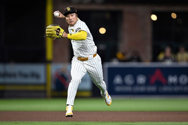 Apr 30, 2024; San Diego, California, USA; San Diego Padres shortstop Ha-Seong Kim (7) throws to first base on a ground out by Cincinnati Reds third baseman Santiago Espinal (not pictured) during the fifth inning at Petco Park. Mandatory Credit: Orlando Ramirez-USA TODAY Sports