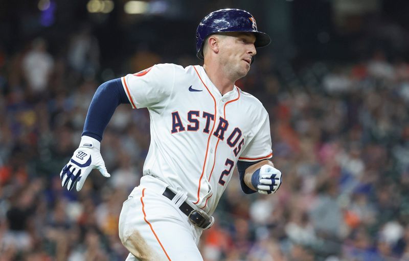 Apr 3, 2024; Houston, Texas, USA; Houston Astros third baseman Alex Bregman (2) hits a double during the sixth inning against the Toronto Blue Jays at Minute Maid Park. Mandatory Credit: Troy Taormina-USA TODAY Sports