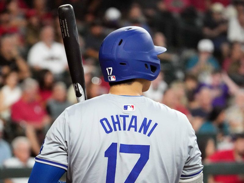 Sep 1, 2024; Phoenix, Arizona, USA; Los Angeles Dodgers two-way player Shohei Ohtani (17) looks on against the Arizona Diamondbacks during the second inning at Chase Field. Mandatory Credit: Joe Camporeale-USA TODAY Sports