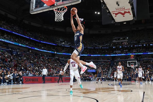 NEW ORLEANS, LA - NOVEMBER 29: Dyson Daniels #11 of the New Orleans Pelicans dunks the ball during the game against the Philadelphia 76ers on November 29, 2023 at the Smoothie King Center in New Orleans, Louisiana. NOTE TO USER: User expressly acknowledges and agrees that, by downloading and or using this Photograph, user is consenting to the terms and conditions of the Getty Images License Agreement. Mandatory Copyright Notice: Copyright 2023 NBAE (Photo by Layne Murdoch Jr./NBAE via Getty Images)