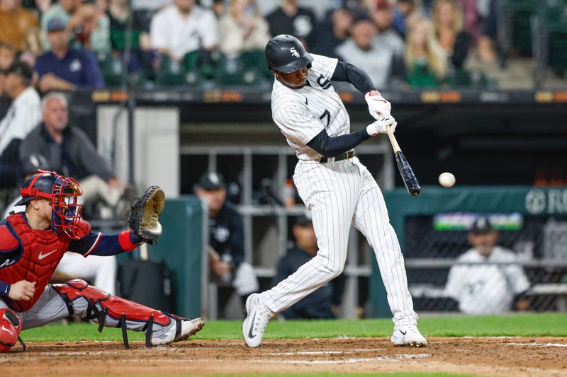 Sep 16, 2023; Chicago, Illinois, USA; Chicago White Sox shortstop Tim Anderson (7) hits one run double against the Minnesota Twins during the seventh inning at Guaranteed Rate Field. Mandatory Credit: Kamil Krzaczynski-USA TODAY Sports