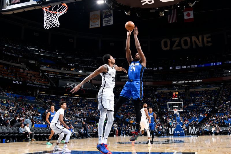 ORLANDO, FL - FEBRUARY 27: Wendell Carter Jr. #34 of the Orlando Magic shoots the ball during the game against the Brooklyn Nets on February 27, 2024 at the Kia Center in Orlando, Florida. NOTE TO USER: User expressly acknowledges and agrees that, by downloading and or using this photograph, User is consenting to the terms and conditions of the Getty Images License Agreement. Mandatory Copyright Notice: Copyright 2024 NBAE (Photo by Fernando Medina/NBAE via Getty Images)