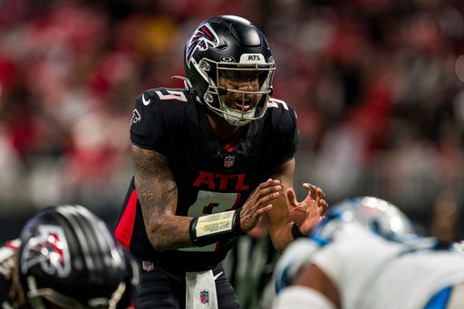 Atlanta Falcons quarterback Michael Penix Jr. (9) works during the second half of an NFL football game against the Carolina Panthers, Sunday, Jan. 5, 2025, in Atlanta. The Panthers defeated the Falcons 44-38. (AP Photo/Danny Karnik)