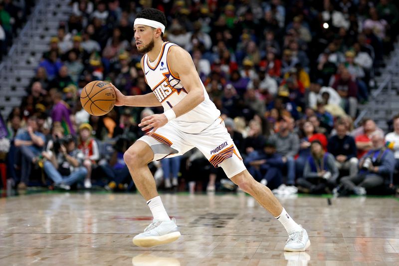 NEW ORLEANS, LOUISIANA - JANUARY 19: Devin Booker #1 of the Phoenix Suns dribbles the ball down court during the third quarter of an NBA game against the New Orleans Pelicans at Smoothie King Center on January 19, 2024 in New Orleans, Louisiana. NOTE TO USER: User expressly acknowledges and agrees that, by downloading and or using this photograph, User is consenting to the terms and conditions of the Getty Images License Agreement. (Photo by Sean Gardner/Getty Images)