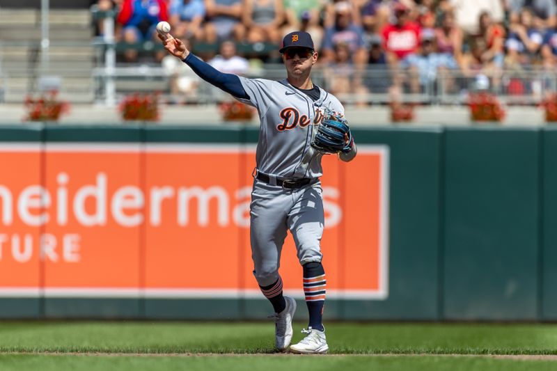 Aug 16, 2023; Minneapolis, Minnesota, USA; Detroit Tigers shortstop Zach McKinstry (39) throws the ball to first base for an out against the Minnesota Twins in the fifth inning at Target Field. Mandatory Credit: Jesse Johnson-USA TODAY Sports