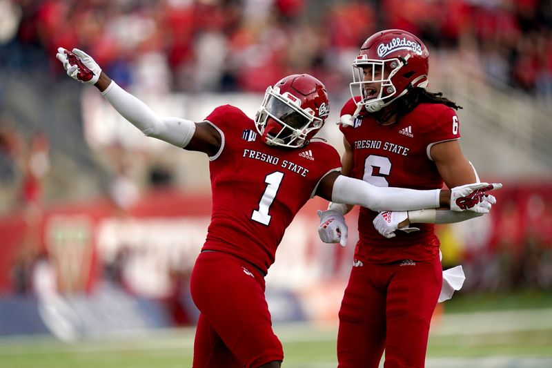 Oct 23, 2021; Fresno, California, USA; Fresno State Bulldogs defensive back Daron Bland (1) celebrates next to linebacker Levelle Bailey (6) after intercepting a pass against the Nevada Wolf Pack in the first quarter at Bulldog Stadium. Mandatory Credit: Cary Edmondson-USA TODAY Sports