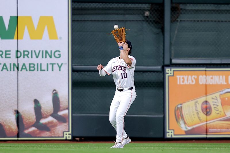 May 5, 2024; Houston, Texas, USA; Houston Astros center fielder Joey Loperfido (10) catches a fly ball for an out against the Seattle Mariners during the third inning at Minute Maid Park. Mandatory Credit: Erik Williams-USA TODAY Sports