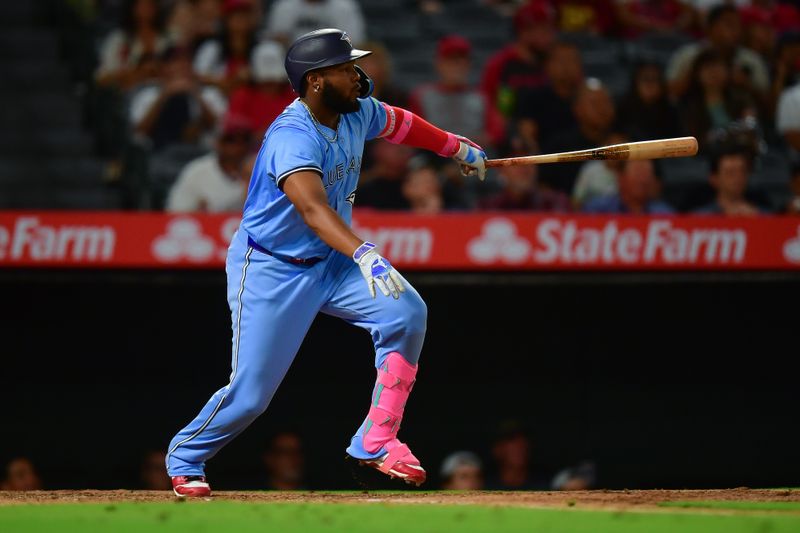 Aug 12, 2024; Anaheim, California, USA; Toronto Blue Jays second baseman Will Wagner (7) hits a single against the Los Angeles Angels during the seventh inning at Angel Stadium. Mandatory Credit: Gary A. Vasquez-USA TODAY Sports