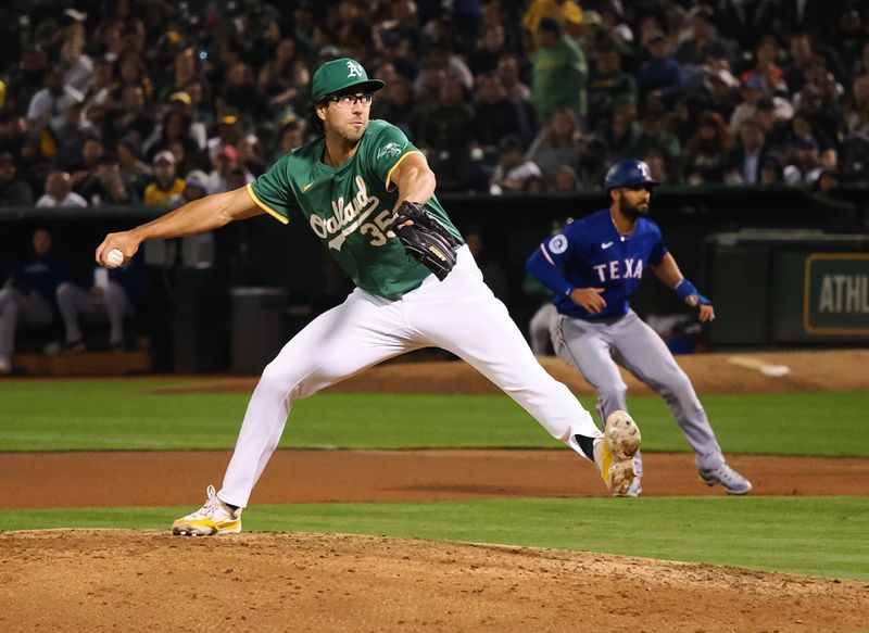 Sep 25, 2024; Oakland, California, USA; Oakland Athletics relief pitcher Joe Boyle (35) pitches the ball ahead of Texas Rangers second baseman Marcus Semien (2) during the fourth inning at Oakland-Alameda County Coliseum. Mandatory Credit: Kelley L Cox-Imagn Images