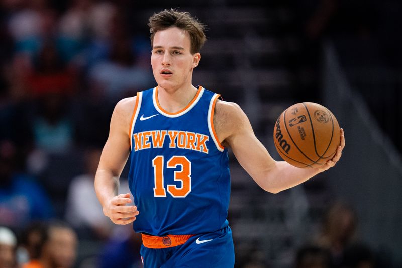 CHARLOTTE, NORTH CAROLINA - OCTOBER 06: Tyler Kolek #13 of the New York Knicks brings the ball up court in the fourth quarter during a preseason game against the Charlotte Hornets at Spectrum Center on October 06, 2024 in Charlotte, North Carolina. NOTE TO USER: User expressly acknowledges and agrees that, by downloading and or using this photograph, User is consenting to the terms and conditions of the Getty Images License Agreement. (Photo by Jacob Kupferman/Getty Images)