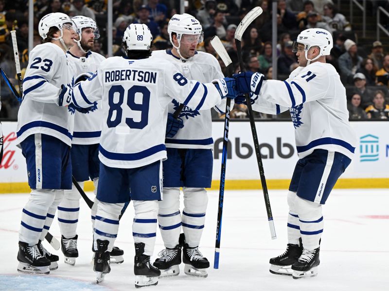 Feb 25, 2025; Boston, Massachusetts, USA; Toronto Maple Leafs defenseman Morgan Rielly (44) celebrates with his teammates after scoring a goal against the Boston Bruins during the second period at the TD Garden. Mandatory Credit: Brian Fluharty-Imagn Images
