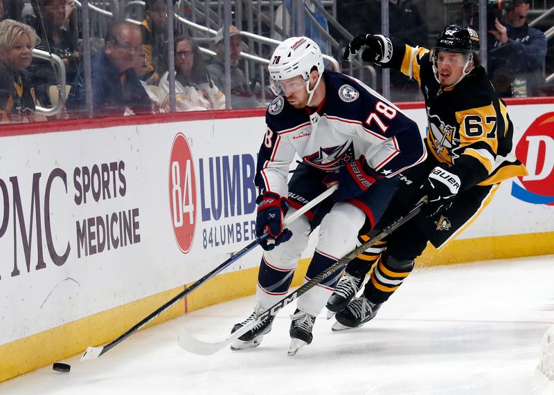 Mar 5, 2024; Pittsburgh, Pennsylvania, USA; Columbus Blue Jackets defenseman Damon Severson (78) moves the puck against Pittsburgh Penguins right wing Rickard Rakell (67) during the third period at PPG Paints Arena. The Penguins won 5-3. Mandatory Credit: Charles LeClaire-USA TODAY Sports