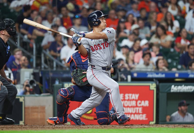 Aug 19, 2024; Houston, Texas, USA; Boston Red Sox pinch hitter Masataka Yoshida (7) hits a home run during the sixth inning against the Houston Astros at Minute Maid Park. Mandatory Credit: Troy Taormina-USA TODAY Sports