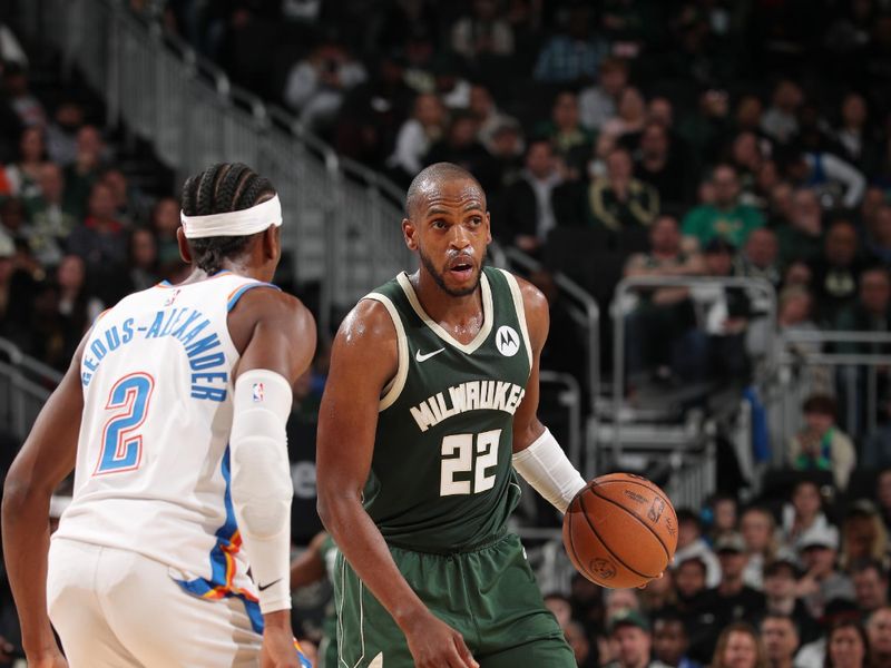 MILWAUKEE, WI - MARCH 24:  Khris Middleton #22 of the Milwaukee Bucks handles the ball during the game against the Oklahoma City Thunder on March 24, 2024 at the Fiserv Forum Center in Milwaukee, Wisconsin. NOTE TO USER: User expressly acknowledges and agrees that, by downloading and or using this Photograph, user is consenting to the terms and conditions of the Getty Images License Agreement. Mandatory Copyright Notice: Copyright 2024 NBAE (Photo by Gary Dineen/NBAE via Getty Images).