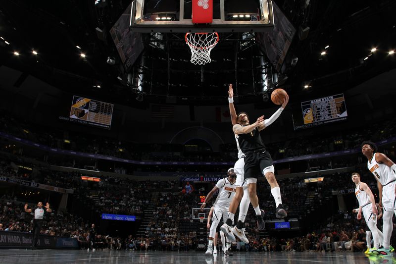 MEMPHIS, TN - APRIL 14:  Scotty Pippen Jr. #1 of the Memphis Grizzlies drives to the basket during the game against the Denver Nuggets on April 14, 2024 at FedExForum in Memphis, Tennessee. NOTE TO USER: User expressly acknowledges and agrees that, by downloading and or using this photograph, User is consenting to the terms and conditions of the Getty Images License Agreement. Mandatory Copyright Notice: Copyright 2024 NBAE (Photo by Joe Murphy/NBAE via Getty Images)