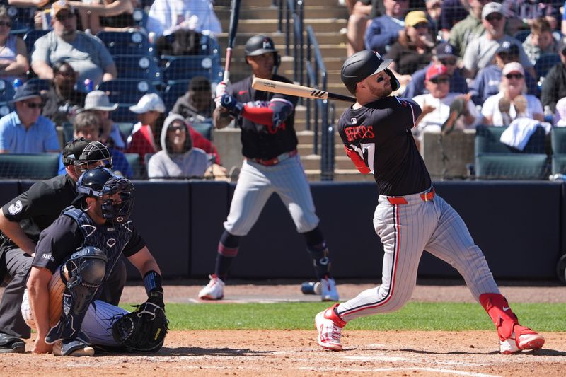 Mar 6, 2025; Tampa, Florida, USA; Minnesota Twins catcher Ryan Jeffers (27) hits a single against the New York Yankees during the fourth inning at George M. Steinbrenner Field. Mandatory Credit: Dave Nelson-Imagn Images