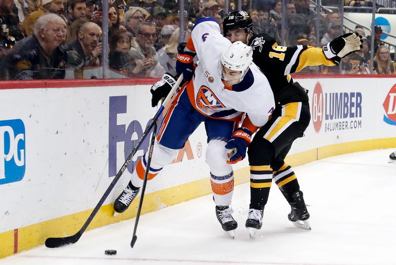 Mar 9, 2023; Pittsburgh, Pennsylvania, USA;  New York Islanders defenseman Adam Pelech (3) moves the puck against Pittsburgh Penguins left wing Jason Zucker (16) during the third period at PPG Paints Arena. The Islanders won 4-3 in overtime. Mandatory Credit: Charles LeClaire-USA TODAY Sports