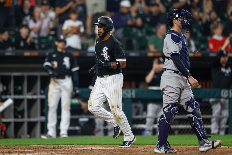 Aug 9, 2023; Chicago, Illinois, USA; Chicago White Sox shortstop Elvis Andrus (1) scores against the New York Yankees during the eight inning at Guaranteed Rate Field. Mandatory Credit: Kamil Krzaczynski-USA TODAY Sports