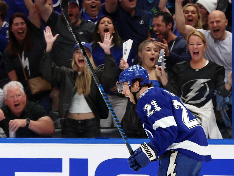 Apr 27, 2024; Tampa, Florida, USA; Tampa Bay Lightning center Brayden Point (21) celebrates after he scored a goal against the Florida Panthers during the first period in game four of the first round of the 2024 Stanley Cup Playoffs at Amalie Arena. Mandatory Credit: Kim Klement Neitzel-USA TODAY Sports