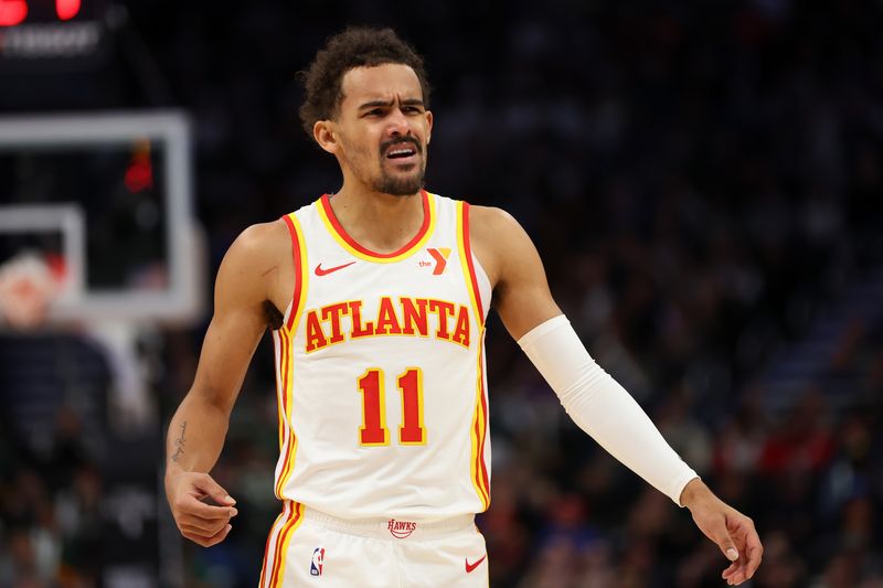 MILWAUKEE, WISCONSIN - DECEMBER 02: Trae Young #11 of the Atlanta Hawks reacts to an officials call during the first half of a game against the Milwaukee Bucks at Fiserv Forum on December 02, 2023 in Milwaukee, Wisconsin. NOTE TO USER: User expressly acknowledges and agrees that, by downloading and or using this photograph, User is consenting to the terms and conditions of the Getty Images License Agreement. (Photo by Stacy Revere/Getty Images)