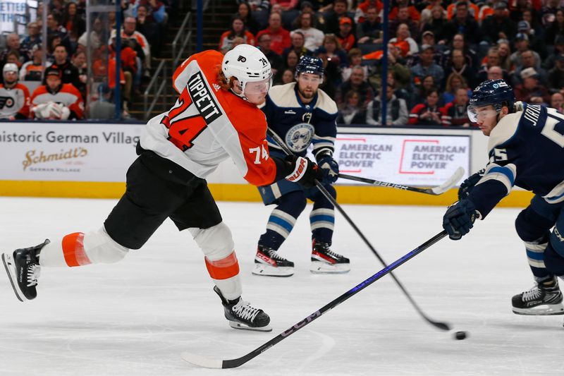 Apr 6, 2024; Columbus, Ohio, USA; Philadelphia Flyers right wing Owen Tippett (74) wrists a shot on goal as Columbus Blue Jackets defenseman David Jiricek (55) defends during the second period at Nationwide Arena. Mandatory Credit: Russell LaBounty-USA TODAY Sports