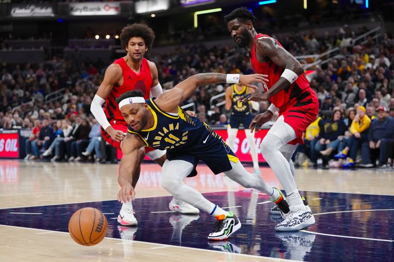 INDIANAPOLIS, INDIANA - NOVEMBER 27: Bruce Brown #11 of the Indiana Pacers dives after a loose ball while Matisse Thybulle #4 (L) and Deandre Ayton #2 (R) of the Portland Trail Blazers look on during the third quarter at Gainbridge Fieldhouse on November 27, 2023 in Indianapolis, Indiana. NOTE TO USER: User expressly acknowledges and agrees that, by downloading and or using this photograph, User is consenting to the terms and conditions of the Getty Images License Agreement. (Photo by Dylan Buell/Getty Images)