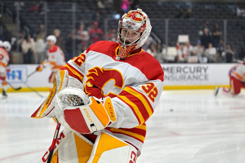 Apr 11, 2024; Los Angeles, California, USA;  Calgary Flames goaltender Dustin Wolf (32) warms up prior to the game against the Los Angeles Kings at Crypto.com Arena. Mandatory Credit: Jayne Kamin-Oncea-USA TODAY Sports