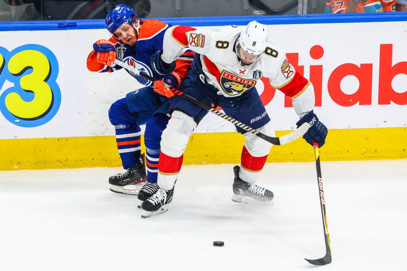 Jun 15, 2024; Edmonton, Alberta, CAN; Florida Panthers right wing Kyle Okposo (8) and Edmonton Oilers center Mattias Janmark (13) battles for the puck during the second period in game four of the 2024 Stanley Cup Final at Rogers Place. Mandatory Credit: Sergei Belski-USA TODAY Sports