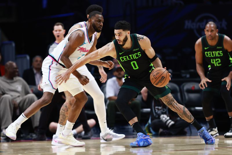 MIAMI, FLORIDA - FEBRUARY 10: Jayson Tatum #0 of the Boston Celtics drives around Andrew Wiggins #22 of the Miami Heat during the second half at Kaseya Center on February 10, 2025 in Miami, Florida. NOTE TO USER: User expressly acknowledges and agrees that, by downloading and or using this Photograph, user is consenting to the terms and conditions of the Getty Images License Agreement. (Photo by Carmen Mandato/Getty Images)