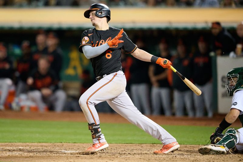 Aug 18, 2023; Oakland, California, USA; Baltimore Orioles designated hitter Ryan Mountcastle (6) swings the bat against the Oakland Athletics during the sixth inning at Oakland-Alameda County Coliseum. Mandatory Credit: Robert Edwards-USA TODAY Sports