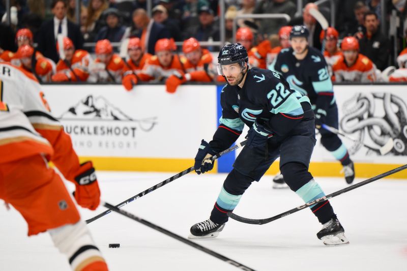 Nov 27, 2024; Seattle, Washington, USA; Seattle Kraken right wing Oliver Bjorkstrand (22) plays the puck during the third period against the Anaheim Ducks at Climate Pledge Arena. Mandatory Credit: Steven Bisig-Imagn Images