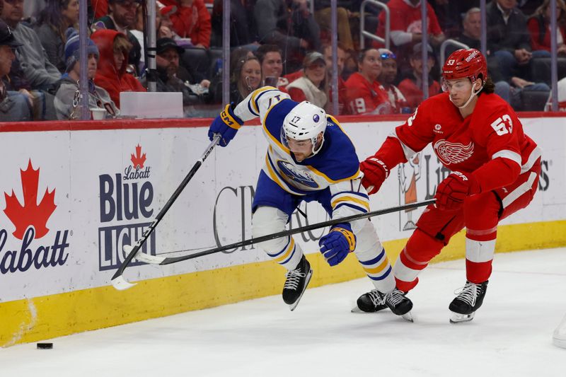 Apr 7, 2024; Detroit, Michigan, USA; Buffalo Sabres center Tyson Jost (17) skates with the puck chased by Detroit Red Wings defenseman Moritz Seider (53) in the third period at Little Caesars Arena. Mandatory Credit: Rick Osentoski-USA TODAY Sports