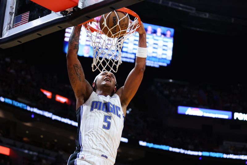 MIAMI, FLORIDA - FEBRUARY 06: Paolo Banchero #5 of the Orlando Magic dunks the ball against the Miami Heat during the first quarter of the game at Kaseya Center on February 06, 2024 in Miami, Florida. NOTE TO USER: User expressly acknowledges and agrees that, by downloading and or using this photograph, User is consenting to the terms and conditions of the Getty Images License Agreement. (Photo by Megan Briggs/Getty Images)