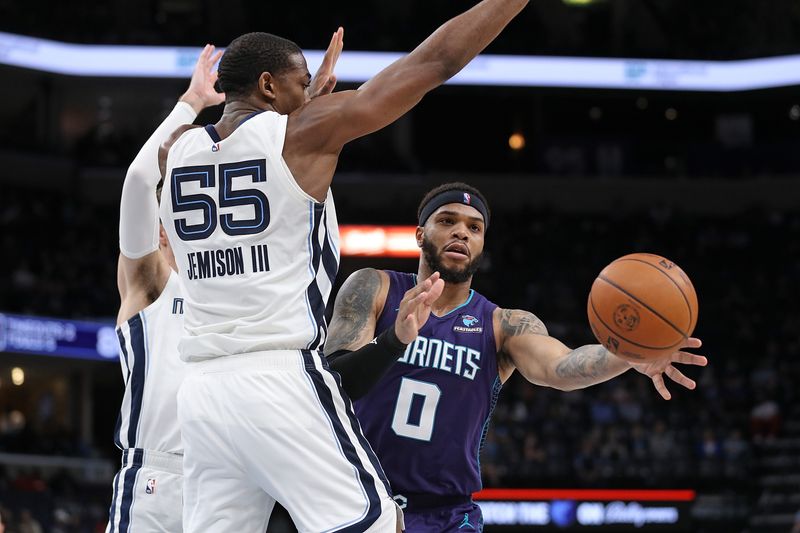 MEMPHIS, TENNESSEE - MARCH 13: Miles Bridges #0 of the Charlotte Hornets passes the ball against Trey Jemison #55 of the Memphis Grizzlies \d2h at FedExForum on March 13, 2024 in Memphis, Tennessee. NOTE TO USER: User expressly acknowledges and agrees that, by downloading and or using this photograph, User is consenting to the terms and conditions of the Getty Images License Agreement. (Photo by Justin Ford/Getty Images)