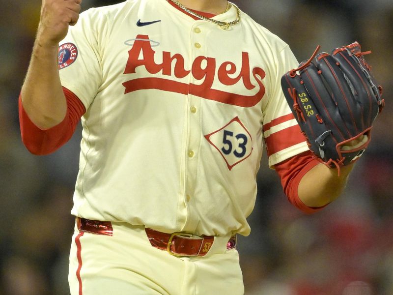 Jul 13, 2024; Anaheim, California, USA;  Carlos Estevez #53 of the Los Angeles Angels celebrates as he earns his 17th save of the season defeating the Seattle Mariners in the ninth inning at Angel Stadium. Mandatory Credit: Jayne Kamin-Oncea-USA TODAY Sports