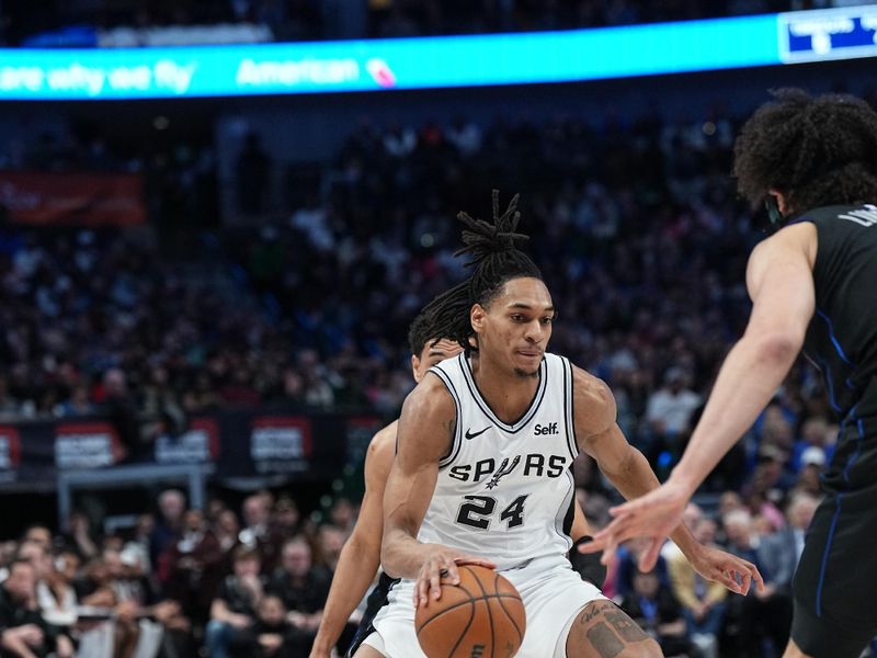 DALLAS, TX - FEBRUARY 14: Devin Vassell #24 of the San Antonio Spurs handles the ball during the game against the Dallas Mavericks on February 14, 2024 at the American Airlines Center in Dallas, Texas. NOTE TO USER: User expressly acknowledges and agrees that, by downloading and or using this photograph, User is consenting to the terms and conditions of the Getty Images License Agreement. Mandatory Copyright Notice: Copyright 2024 NBAE (Photo by Glenn James/NBAE via Getty Images)