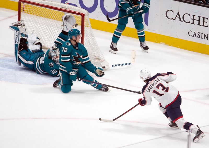 Mar 14, 2023; San Jose, California, USA; Columbus Blue Jackets left winger Johnny Gaudreau (13) shoots the game-winning goal past San Jose Sharks goaltender Kaapo Kahkonen (36) in overtime at SAP Center at San Jose. Mandatory Credit: D. Ross Cameron-USA TODAY Sports