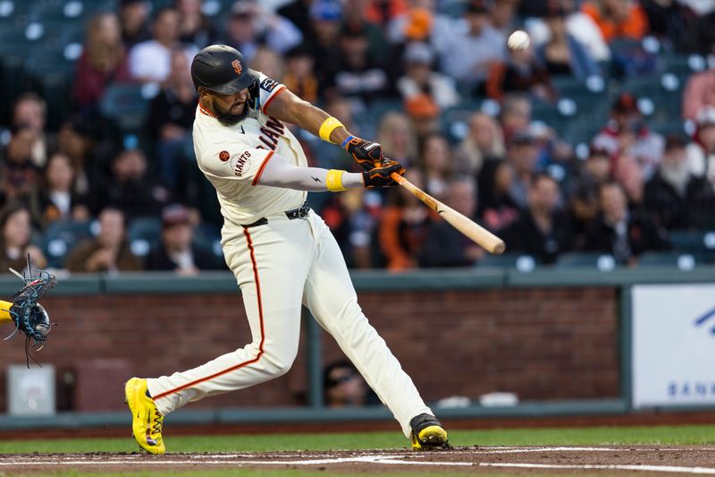 Sep 11, 2024; San Francisco, California, USA; San Francisco Giants designated hitter Jerar Encarnacion (59) hits a two-run home run against the Milwaukee Brewers during the first inning at Oracle Park. Mandatory Credit: John Hefti-Imagn Images