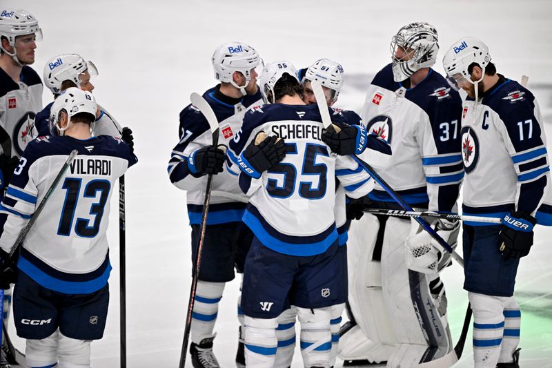 May 17, 2025; Dallas, Texas, USA; The Winnipeg Jets console center Mark Scheifele (55) as Scheifele leaves the penalty box after the loss to the Dallas Stars during the overtime period in game six of the second round of the 2025 Stanley Cup Playoffs at American Airlines Center. Mandatory Credit: Jerome Miron-Imagn Images