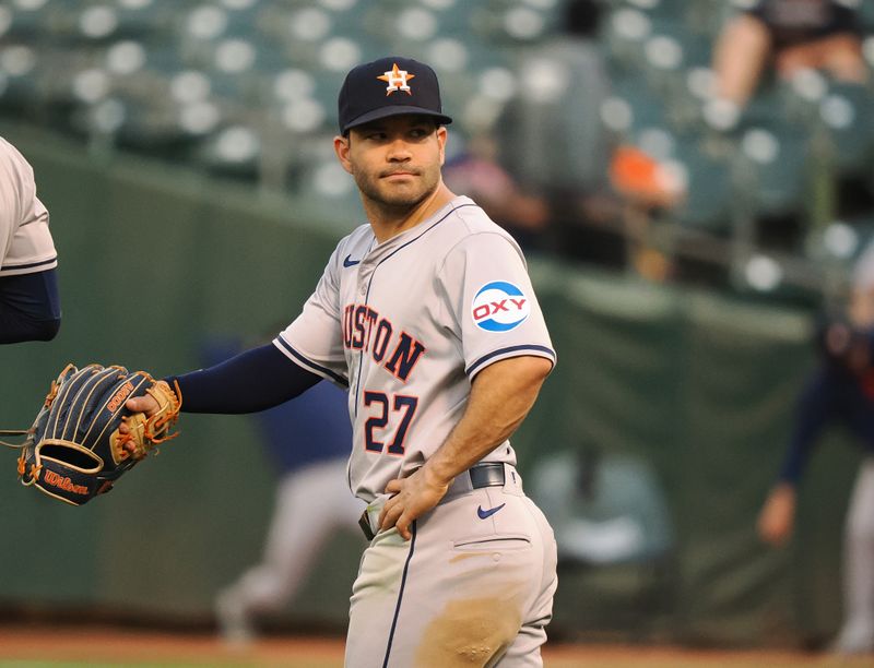 Jul 22, 2024; Oakland, California, USA; Houston Astros second baseman Jose Altuve (27) looks over his shoulder between plays against the Oakland Athletics during the fourth inning at Oakland-Alameda County Coliseum. Mandatory Credit: Kelley L Cox-USA TODAY Sports