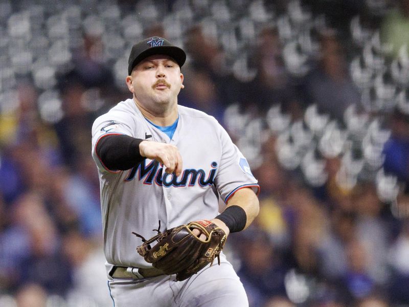 Sep 13, 2023; Milwaukee, Wisconsin, USA;  Miami Marlins third baseman Jake Burger (36) throws to first base during the third inning against the Milwaukee Brewers at American Family Field. Mandatory Credit: Jeff Hanisch-USA TODAY Sports