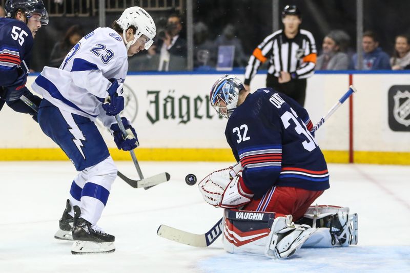 Feb 7, 2024; New York, New York, USA; New York Rangers goaltender Jonathan Quick (32) makes a save on a shot on goal attempt by Tampa Bay Lightning center Michael Eyssimont (23) in the third period at Madison Square Garden. Mandatory Credit: Wendell Cruz-USA TODAY Sports