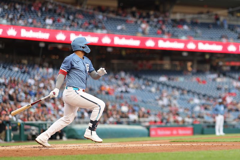 May 23, 2025; Washington, District of Columbia, USA; Washington Nationals second base Luis García Jr. (2) doubles against the San Francisco Giants during the second inning at Nationals Park. Mandatory Credit: Geoff Burke-Imagn Images