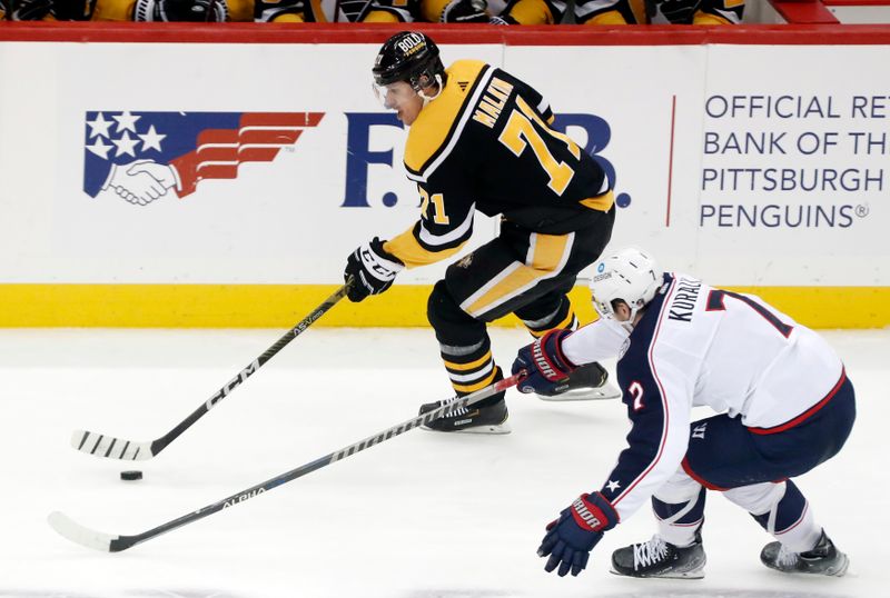 Dec 6, 2022; Pittsburgh, Pennsylvania, USA;  Pittsburgh Penguins center Evgeni Malkin (71) skates with the puck against Columbus Blue Jackets center Sean Kuraly (7) during the second period at PPG Paints Arena. Mandatory Credit: Charles LeClaire-USA TODAY Sports