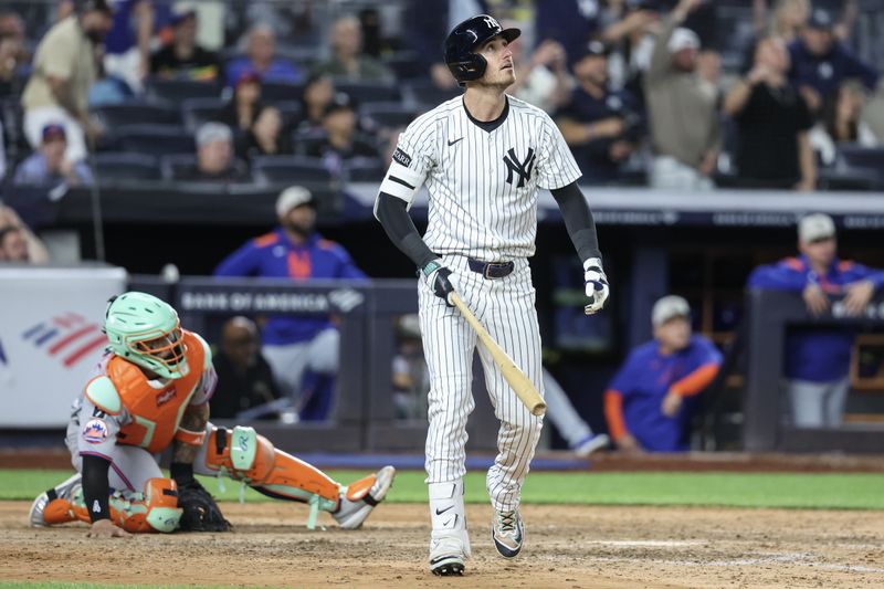 May 18, 2025; Bronx, New York, USA;  New York Yankees left fielder Cody Bellinger (35) hits a grand slam home run in the eighth inning against the New York Mets at Yankee Stadium. Mandatory Credit: Wendell Cruz-Imagn Images