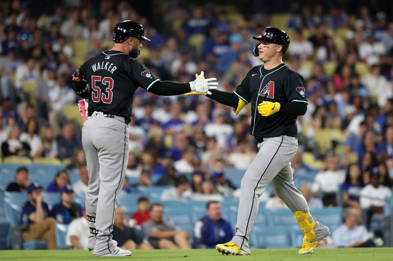 Jul 2, 2024; Los Angeles, California, USA;  Arizona Diamondbacks designated hitter Joc Pederson (3) celebrates with first baseman Christian Walker (53) after hitting a home run during the ninth inning against the Los Angeles Dodgers at Dodger Stadium. Mandatory Credit: Kiyoshi Mio-USA TODAY Sports