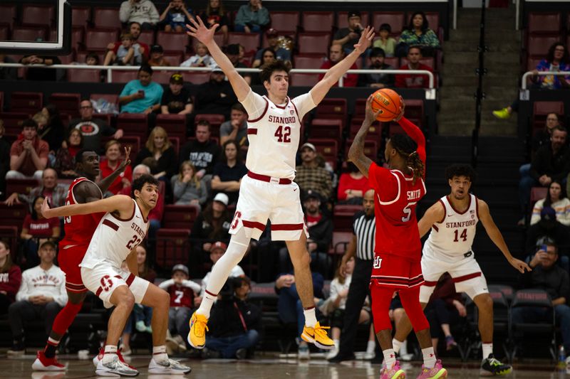 Jan 14, 2024; Stanford, California, USA; Stanford Cardinal forward Maxime Raynaud (42) guards Utah Utes guard Deivon Smith (5) during the second half at Maples Pavilion. Mandatory Credit: D. Ross Cameron-USA TODAY Sports